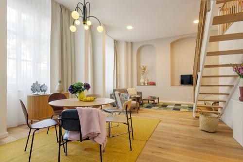 a living room with a table and chairs at homie stay Dominikus in Würzburg