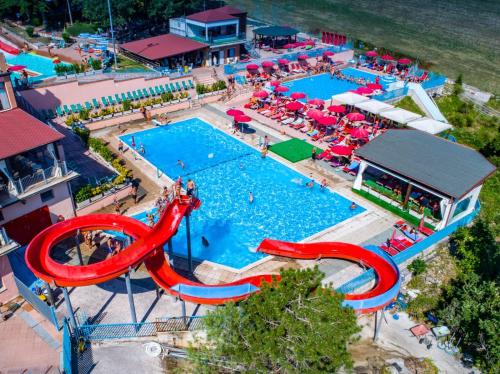an overhead view of a pool with a water slide at Hotel Eldorado in Apiro