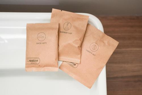a couple of brown paper towels sitting on a table at Mercure Bologna Centro in Bologna