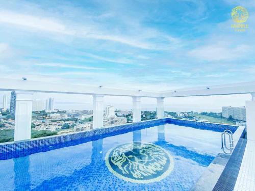 a swimming pool on the roof of a building at The Empire Tower Pattaya in Jomtien Beach