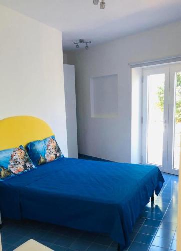 Ένα ή περισσότερα κρεβάτια σε δωμάτιο στο Chalet del sole Sorrento Coast