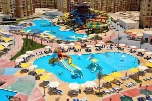 Bazén v ubytování Aqua view العلمين alamein 3 bedroom apartment nebo v jeho okolí
