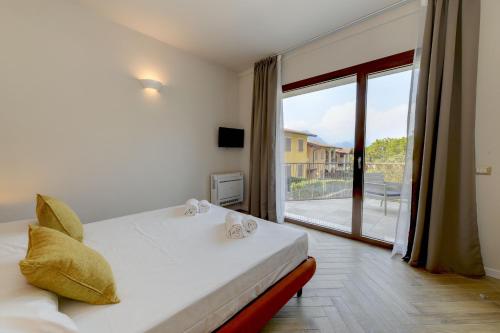 Postel nebo postele na pokoji v ubytování Gardaliva 7 By The Lake