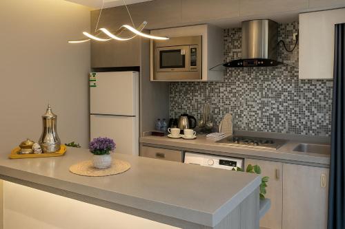 Kuchyň nebo kuchyňský kout v ubytování Elite Served Apartments - Al Andalus