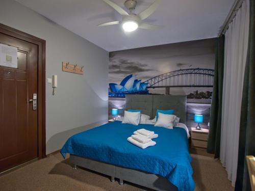 Posteľ alebo postele v izbe v ubytovaní Apartamenty studio Metropolio Centrum