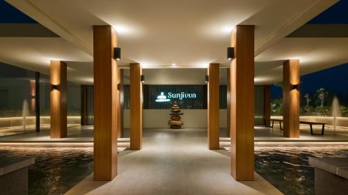 a lobby of a resort with a swimming pool at Holiday Inn Resort Bintan Lagoi Beach by IHG in Lagoi
