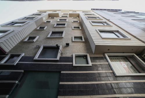 a tall building with many windows on the side of it at Townhouse Hollywood Heights in Amritsar