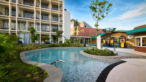an image of a swimming pool at a hotel at Holiday Inn Resort Bintan Lagoi Beach by IHG in Lagoi