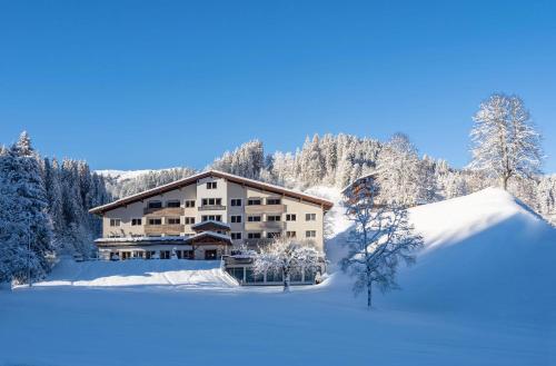 a lodge in the snow on a frozen lake at Haus am Wildbach in Auffach