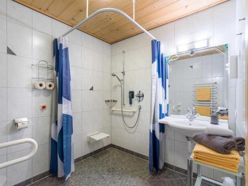a bathroom with a shower and a sink at Haus am Wildbach in Auffach