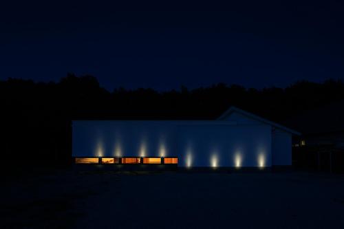 a building with lights on it at night at Villa Moriyoshi in Tomakomai