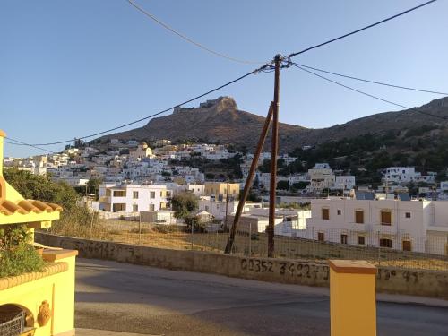 a view of a city from the balcony of a house at Theodore's Mansion Your aristocratic escape in Greece in Panteli