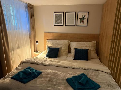 a bedroom with a bed with two pillows on it at Apartmán U Baziliky in Olomouc