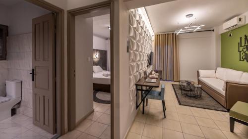 a room with a bathroom and a living room at Well Being Luxury Apartments in Évdhilos