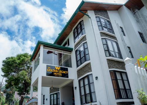 a building with a sign for a hotel at The Golden Legacy Hotel in Nuwara Eliya