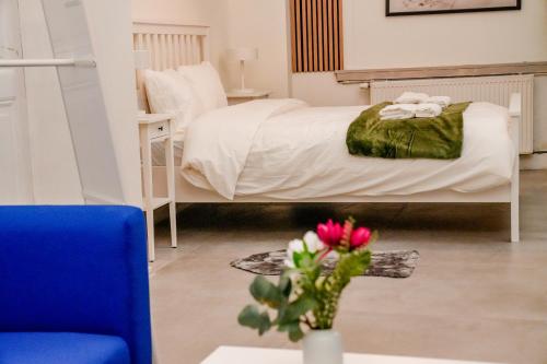 Ένα ή περισσότερα κρεβάτια σε δωμάτιο στο 6 Stylish & Comfortable Studios , Heart of Gent
