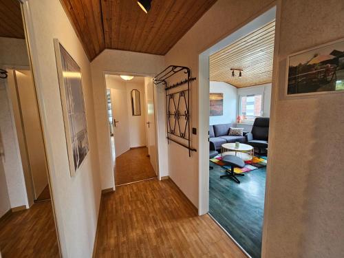 a hallway of a home with a living room at Ferienwohnung Moi Tied 35677 in Uplengen