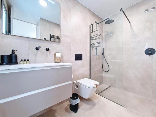 a bathroom with a shower and a toilet and a sink at Villa Verano San Javier - 6610 in San Javier