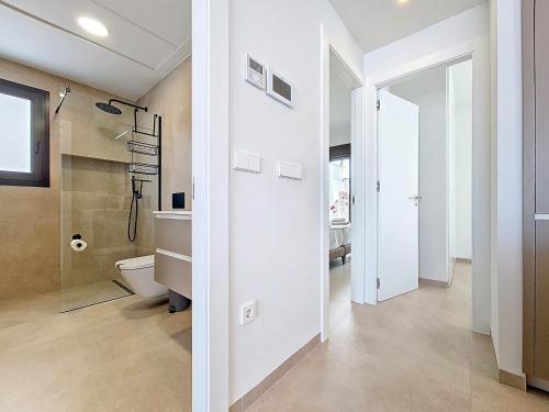 a bathroom with a toilet and a walk in shower at Villa Verano San Javier - 6610 in San Javier