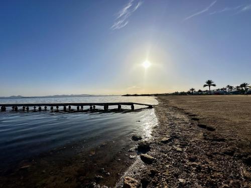 a beach with a pier in the water at Villa Verano San Javier - 6610 in San Javier