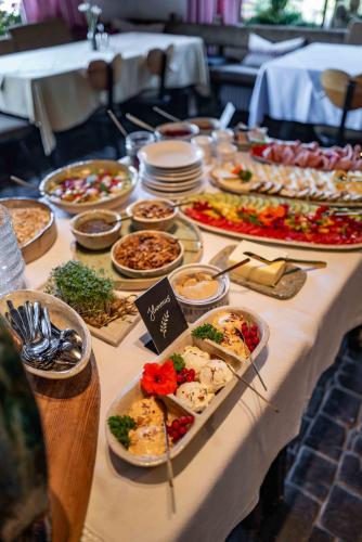 a buffet table with many different types of food at Berghotel Blaickner's Sonnalm in Zell am See
