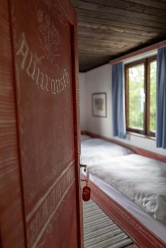 an open door to a room with two beds at Berghotel Blaickner's Sonnalm in Zell am See
