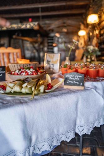 a table with plates of food on a table at Berghotel Blaickner's Sonnalm in Zell am See