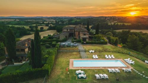 an aerial view of a house with a swimming pool at Top of hill, with view on Siena, Chianti and Crete in Montaperti