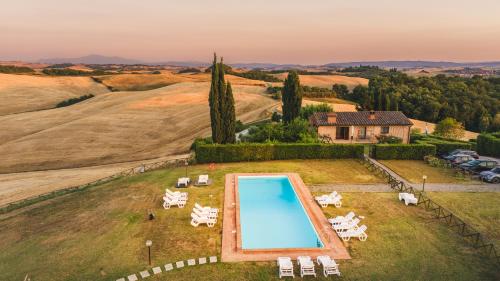 an aerial view of a villa with a swimming pool at Top of hill, with view on Siena, Chianti and Crete in Montaperti