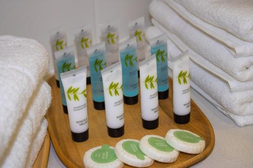 a group of candles on a table with cookies at Virexxa Bedford Centre - Alpha Suite - 2Bed Flat with Free Parking & Gym in Bedford