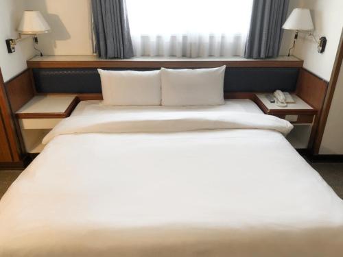 Guide Hotel Changhua Jhongjhengにあるベッド