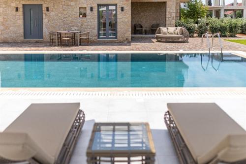 two views of a swimming pool with chairs and a table at Ampeli Villas in Stoupa
