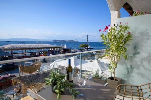 a balcony with a table with a view of the ocean at Sea View Center in Limenas