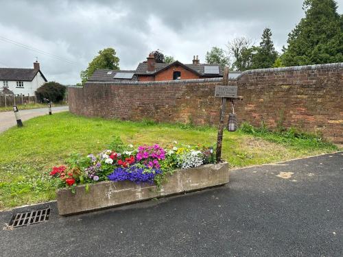 a flower box on the side of a road at The Hurst Coach House in Stafford