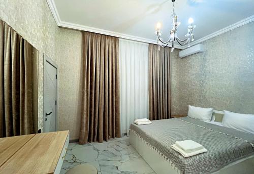 Giường trong phòng chung tại Panorama Deluxe Gabala