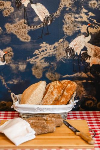 a table with a plate of bread on a table at Casa Victoria in Spigno Monferrato