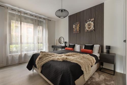Ένα ή περισσότερα κρεβάτια σε δωμάτιο στο Scala Apartamenty by Moderna Profit- Łąkowa 60E z parkingiem