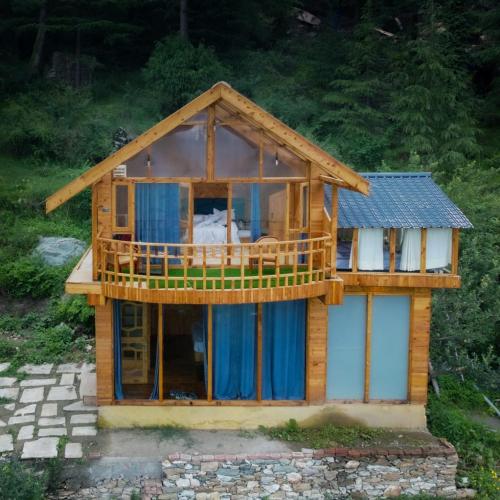 a model of a house with a balcony at Glass House by Himalayan Cedar Nest in Sainj