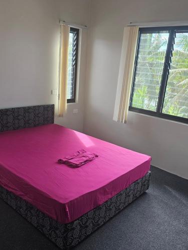 Giường trong phòng chung tại IK & PK bnb