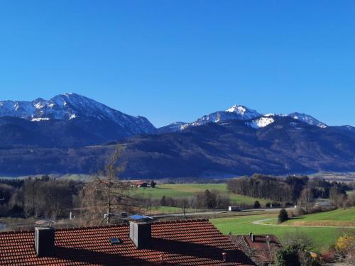a view of the mountains from a farm at Hotel Garni Alpenblick in Bergen