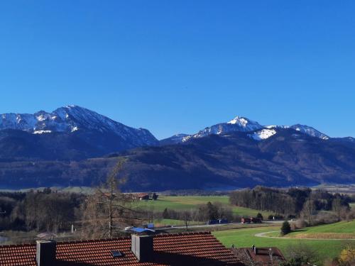 a mountain range with snow covered mountains in the background at Hotel Garni Alpenblick in Bergen