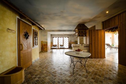a kitchen with a table in the middle of a room at Thermenhotel Vier Jahreszeiten in Lutzmannsburg