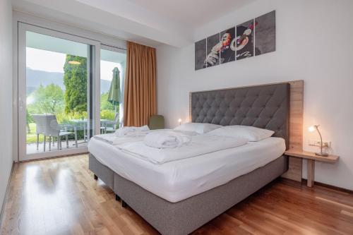 A bed or beds in a room at Apartments Schluga