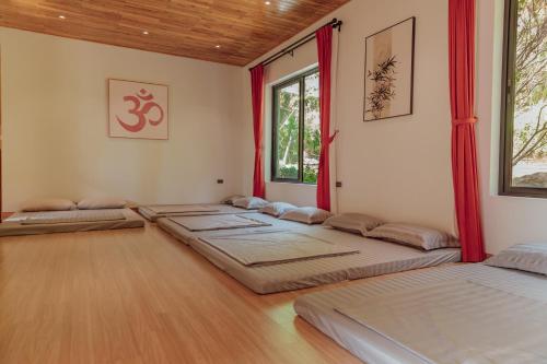 Postel nebo postele na pokoji v ubytování Shohin Garden