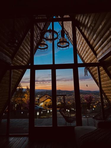 a window view of a city from a house at Cozy Cabin House in Novi Pazar