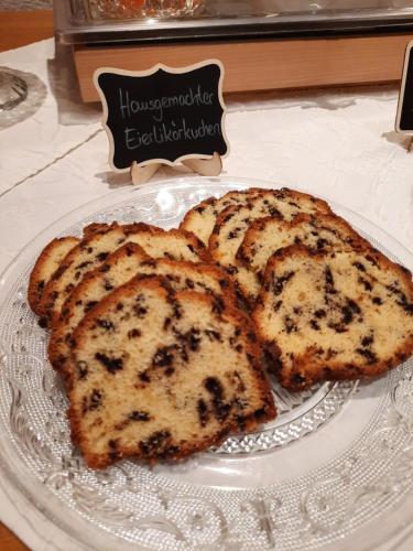 two slices of cake on a plate on a table at Hotel Garni Alpenblick in Bergen