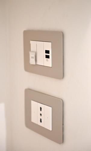 two electrical outlets on a wall at Domus Cassino Centro in Cassino