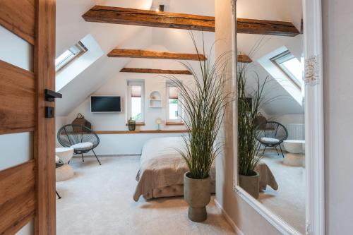 a bedroom with a bed and skylights at Sedmé Nebe Apartmán in Děčín
