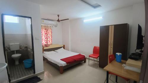 Katil atau katil-katil dalam bilik di Sri Annapurna Residency