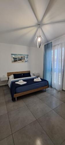 Katil atau katil-katil dalam bilik di Case Vacanze Angolo Sul Mare